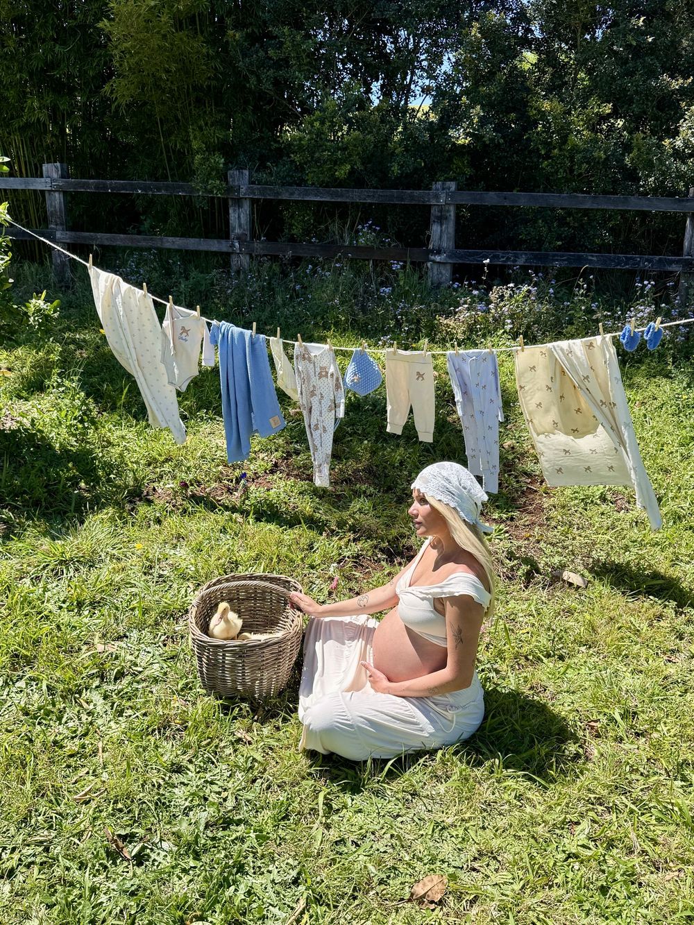 Maternity portrait beside a washing line in the paddock